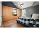 Cozy bedroom with built-in storage, a ceiling fan, and a comfortable bed with a plaid comforter at 3734 Powers Ferry Nw Rd, Atlanta, GA 30342