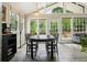 Bright dining area with access to the outdoors and living area at 3734 Powers Ferry Nw Rd, Atlanta, GA 30342