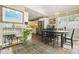 Bright dining area with stone floors, large windows, and a convenient bar cart at 3734 Powers Ferry Nw Rd, Atlanta, GA 30342