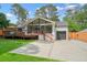 Charming brick home with a spacious deck and a well-maintained front yard at 3734 Powers Ferry Nw Rd, Atlanta, GA 30342