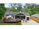 Attractive home with solar panels, spacious deck, and lush landscaping for outdoor living at 3734 Powers Ferry Nw Rd, Atlanta, GA 30342