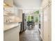 Bright kitchen with stainless steel appliances, tile floors, and a breakfast nook overlooking the backyard at 3734 Powers Ferry Nw Rd, Atlanta, GA 30342