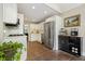 Well-equipped kitchen with stainless appliances, white cabinets, and a cozy dining nook at 3734 Powers Ferry Nw Rd, Atlanta, GA 30342