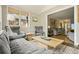Bright living room featuring large windows, neutral furniture, and an area rug on the floor at 3734 Powers Ferry Nw Rd, Atlanta, GA 30342