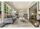 Bright, airy sunroom with large windows and comfortable seating, perfect for relaxation and entertaining at 3734 Powers Ferry Nw Rd, Atlanta, GA 30342