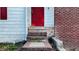 Close-up of the house's red front door and brick and siding exterior at 5415 Twin Lakes Dr, Atlanta, GA 30349