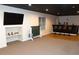 Finished basement with a TV, a wine storage rack, and a stylish bar with seating at 6529 Terraglen Way, Locust Grove, GA 30248