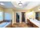 Luxurious bathroom with a soaking tub, walk-in shower, and and vanity sinks at 6529 Terraglen Way, Locust Grove, GA 30248