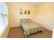Inviting bedroom with soothing green bedding and contemporary artwork for a tranquil atmosphere at 6529 Terraglen Way, Locust Grove, GA 30248