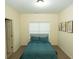 Cozy bedroom with a comfortable bed, soft bedding, and natural light from the window at 6529 Terraglen Way, Locust Grove, GA 30248