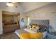 Elegant main bedroom with gray and gold accents, sitting area, and ample natural light at 6529 Terraglen Way, Locust Grove, GA 30248
