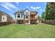 Expansive backyard with lush lawn, spacious deck and fence providing privacy to the home at 1124 Monarda Nw Way, Acworth, GA 30102