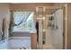 Bright bathroom with soaking tub, glass shower, and outdoor view at 1124 Monarda Nw Way, Acworth, GA 30102