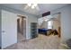 Cozy bedroom featuring gray walls, carpet, ceiling fan, and a comfortable bed at 1124 Monarda Nw Way, Acworth, GA 30102