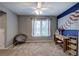 Bedroom featuring carpet, ceiling fan, gray walls, a study desk and chair at 1124 Monarda Nw Way, Acworth, GA 30102