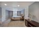 Cozy bedroom with neutral walls, carpet, a bed, and natural light at 1124 Monarda Nw Way, Acworth, GA 30102