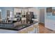Charming kitchen with granite countertops, stainless appliances, and hardwood floors at 1124 Monarda Nw Way, Acworth, GA 30102