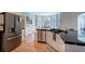 Well-equipped kitchen with stainless steel appliances, granite counters, and hardwood flooring at 1124 Monarda Nw Way, Acworth, GA 30102
