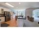 Modern kitchen features a large island with black countertop, stainless appliances, and hardwood floors at 1124 Monarda Nw Way, Acworth, GA 30102