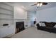 Bright living room offers a ceiling fan, fireplace, and built in shelves for plenty of storage at 1124 Monarda Nw Way, Acworth, GA 30102