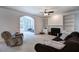Bright living room offers a ceiling fan, fireplace, and built in shelves for plenty of storage at 1124 Monarda Nw Way, Acworth, GA 30102