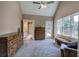 Sun-filled main bedroom with vaulted ceiling and an adjacent bathroom and private balcony at 1124 Monarda Nw Way, Acworth, GA 30102