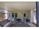 Covered patio with outdoor seating and charming string lights overhead at 1124 Monarda Nw Way, Acworth, GA 30102
