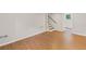 Partially finished basement with wood-look flooring, stairs, and a view of the bathroom through an open door at 2358 Dabney Ter, East Point, GA 30344