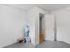 Unfinished basement showing storage area, door, and painted cement floor at 2358 Dabney Ter, East Point, GA 30344