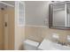 Small bathroom with tan tile features a shower, toilet, and sink at 2358 Dabney Ter, East Point, GA 30344