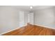 Bedroom features hardwood floors, neutral walls, and access to an adjoining room at 2358 Dabney Ter, East Point, GA 30344