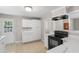 Well-lit kitchen with new appliances, updated countertops, and access to the backyard at 2358 Dabney Ter, East Point, GA 30344