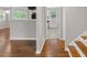 Living room with hardwood floors flowing into the kitchen with tile floors at 2358 Dabney Ter, East Point, GA 30344