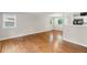 Open-concept living space with hardwood floors, great natural light, and easy access to kitchen at 2358 Dabney Ter, East Point, GA 30344