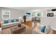 Spacious living room connected to the dining room featuring stylish furnishings at 2358 Dabney Ter, East Point, GA 30344