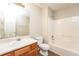 Bathroom vanity with single sink and tub/shower combination with a view to the entry at 4400 Old Allgood Cir, Stone Mountain, GA 30083