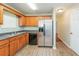 Kitchen featuring stainless steel appliances, wood cabinets and durable countertops at 4400 Old Allgood Cir, Stone Mountain, GA 30083