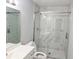 Updated bathroom featuring tiled shower with glass doors, modern vanity, and fixtures at 5025 Highland Club Dr, Marietta, GA 30068
