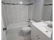 Updated bathroom features stylish black and white tile flooring, white tiled walls, and new vanity at 5025 Highland Club Dr, Marietta, GA 30068