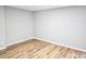 Neutral bedroom with new wood flooring and updated paint is ready for your personal touches at 5025 Highland Club Dr, Marietta, GA 30068