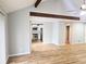 Open living room featuring hardwood floors, bright paint, and direct kitchen access at 5025 Highland Club Dr, Marietta, GA 30068