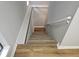 Neutral stairway with new wood floors leads to the home's upper level at 5025 Highland Club Dr, Marietta, GA 30068