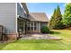 Backyard featuring a stone patio and well-maintained lawn at 1045 Fords Crossing Nw Dr, Acworth, GA 30101