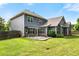 Lush backyard featuring a stone patio and meticulously maintained lawn at 1045 Fords Crossing Nw Dr, Acworth, GA 30101