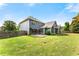 Expansive backyard with lush lawn, stone patio, and beautiful landscaping at 1045 Fords Crossing Nw Dr, Acworth, GA 30101