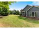 Expansive backyard with lush lawn and tasteful landscaping around the perimeter of the property at 1045 Fords Crossing Nw Dr, Acworth, GA 30101