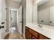 Bathroom featuring vanity and large mirror, complemented by tile flooring and access to additional rooms at 1045 Fords Crossing Nw Dr, Acworth, GA 30101