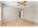 Neutral bedroom with carpet flooring, fan, and view of open door to ensuite at 1045 Fords Crossing Nw Dr, Acworth, GA 30101