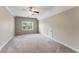 Spacious bedroom with a window and a small door at 1045 Fords Crossing Nw Dr, Acworth, GA 30101