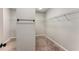 Walk-in closet featuring carpet flooring, white walls, and wire shelving at 1045 Fords Crossing Nw Dr, Acworth, GA 30101